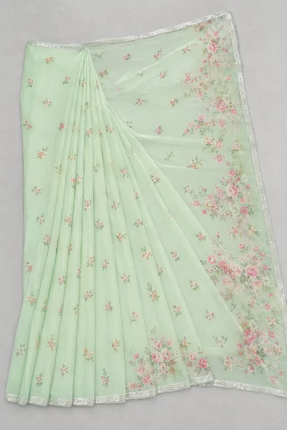 Flat photo of a mint green floral saree next to the AI model photo of the same saree draped
